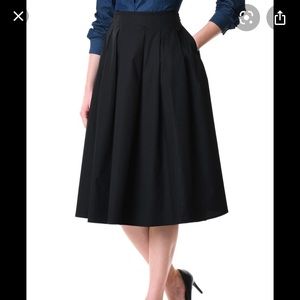 Black pleated knee length skirt